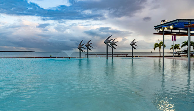 Tropical swimming lagoon on the Esplanade in Cairns with artificial beach, Queensland, Australia