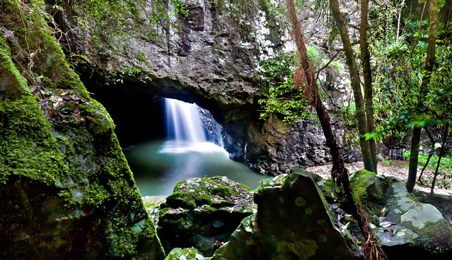 Close up of rocks and a waterfall in the cave