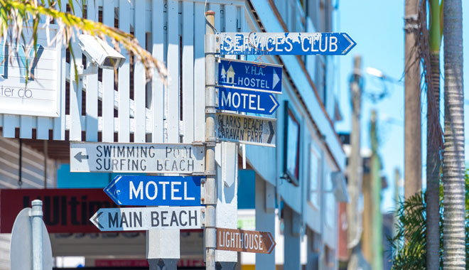 Touristic guidance directional signs on pole in Byron Bay, NSW, Australia