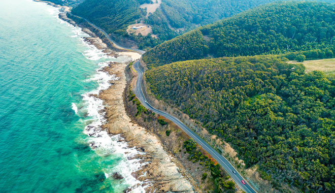 Cars driving on Great Ocean Road, Victoria, Australia    aerial view