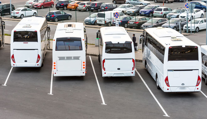 Big white tourist buses on parking. Russia. Saint Petersburg. 09 June 2018.