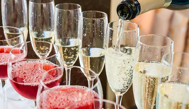 Bartender pouring champagne into glass